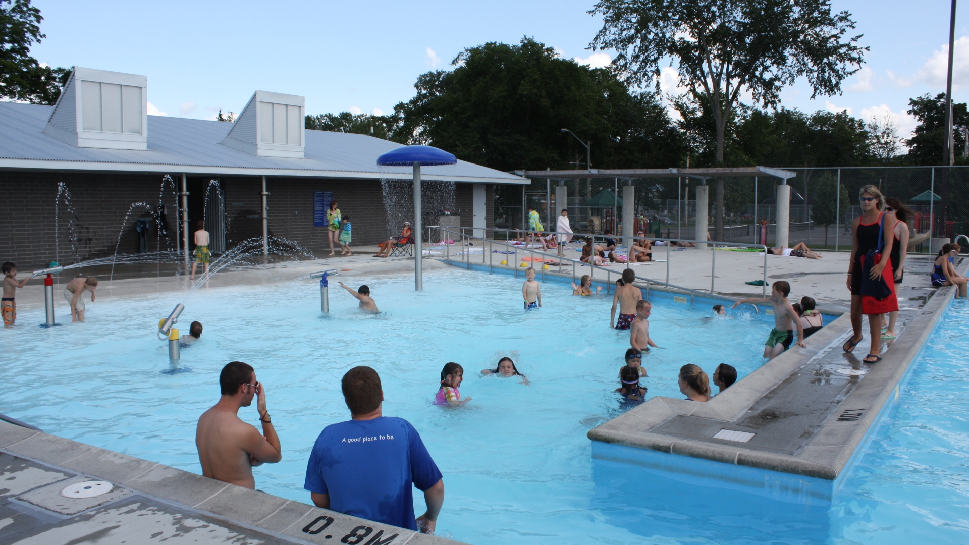 People swimming in outdoor pool
