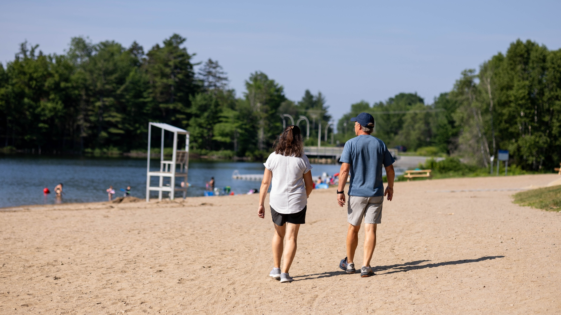 Couple walking on Killarney Lake beach