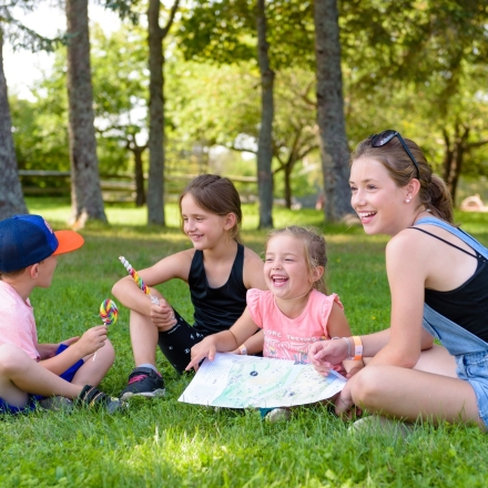 Kids sitting in a park