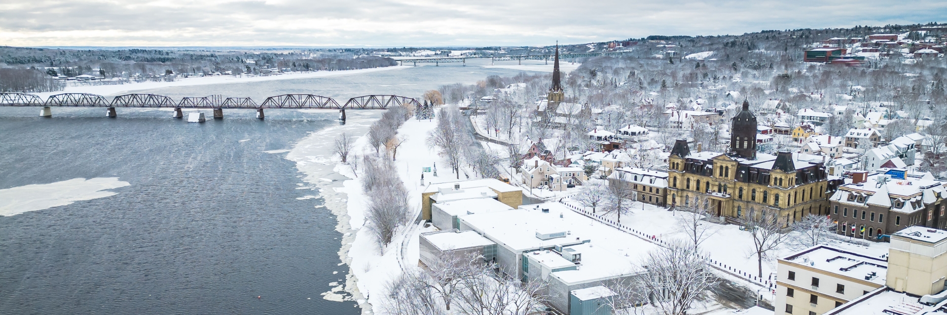 city of Fredericton landscape with bridge and river during the winter