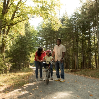 Family biking on trails
