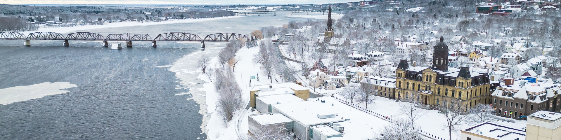 city of Fredericton landscape with bridge and river during the winter